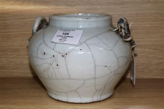Three Chinese porcelain jars, Qing Dynasty - one crackleglaze, a blue and white and a famille rose example tallest 14cm